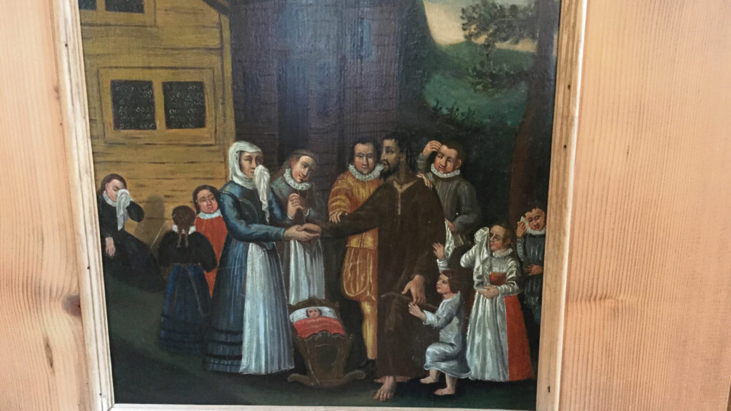 Dorothee Wyss und ihre zehn Kinder nehmen Abschied von Niklaus von Flüe (Bild in der Ranftkapelle). | © Regula Pfeifer, kath.ch