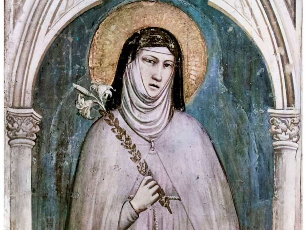 Klara von Assisi – die Lilie als Symbol der Reinheit zeigt an, dass Klara den Jungfrauen zugerechnet wird (Fresko von Giotto di Bondone, Basilika Santa Croce, Florenz, 1325). | © incamerastock/Alamy Stock Foto