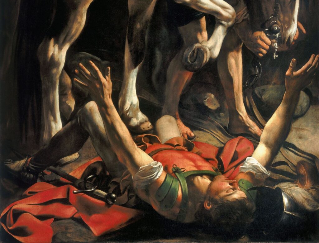 Der Heisssporn Saul ist vom hohen Ross heruntergestürzt. Wie ein Maikäfer liegt er auf dem Rücken, hilflos strampelnd, geblendet von einem übergrellen Licht (Ausschnitt aus Caravaggios Ölgemälde «Bekehrung des Paulus» (Kirche Santa Maria del Popolo, Rom). | © wikimedia